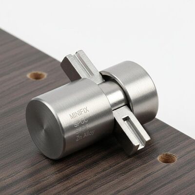 Flat Key Minifix Cam Lock made of SPCC Cold Rolled Steel and Zinc Alloy ensuring strong locking performance in furniture assembly processes